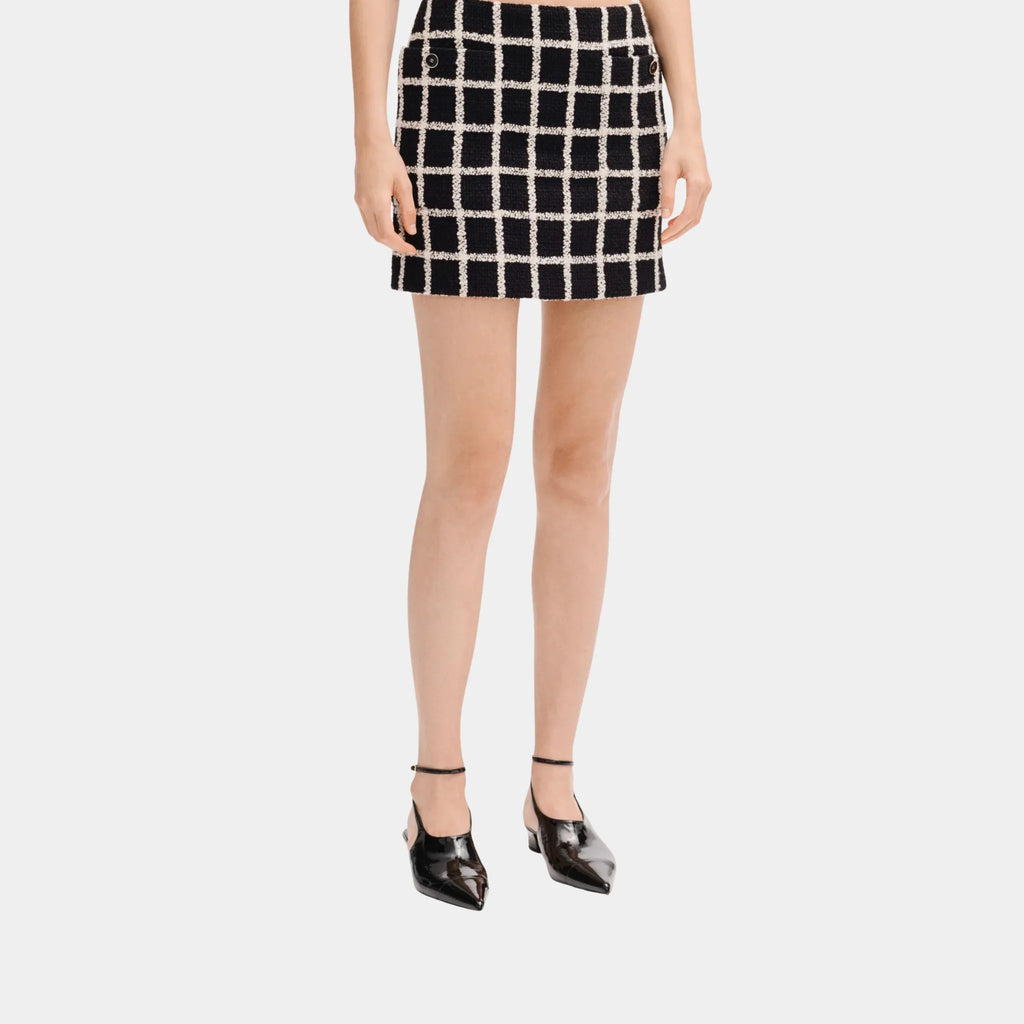 Short Skirt In Black And White Wool Tweed Chanel – Гарантія оригінальності – боковий вид