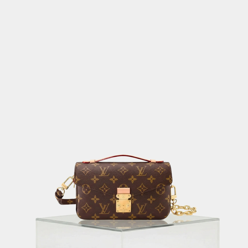 Pochette Métis East West Shoulder Bag Monogram Canvas Louis vuitton – Гарантія оригінальності – боковий вид