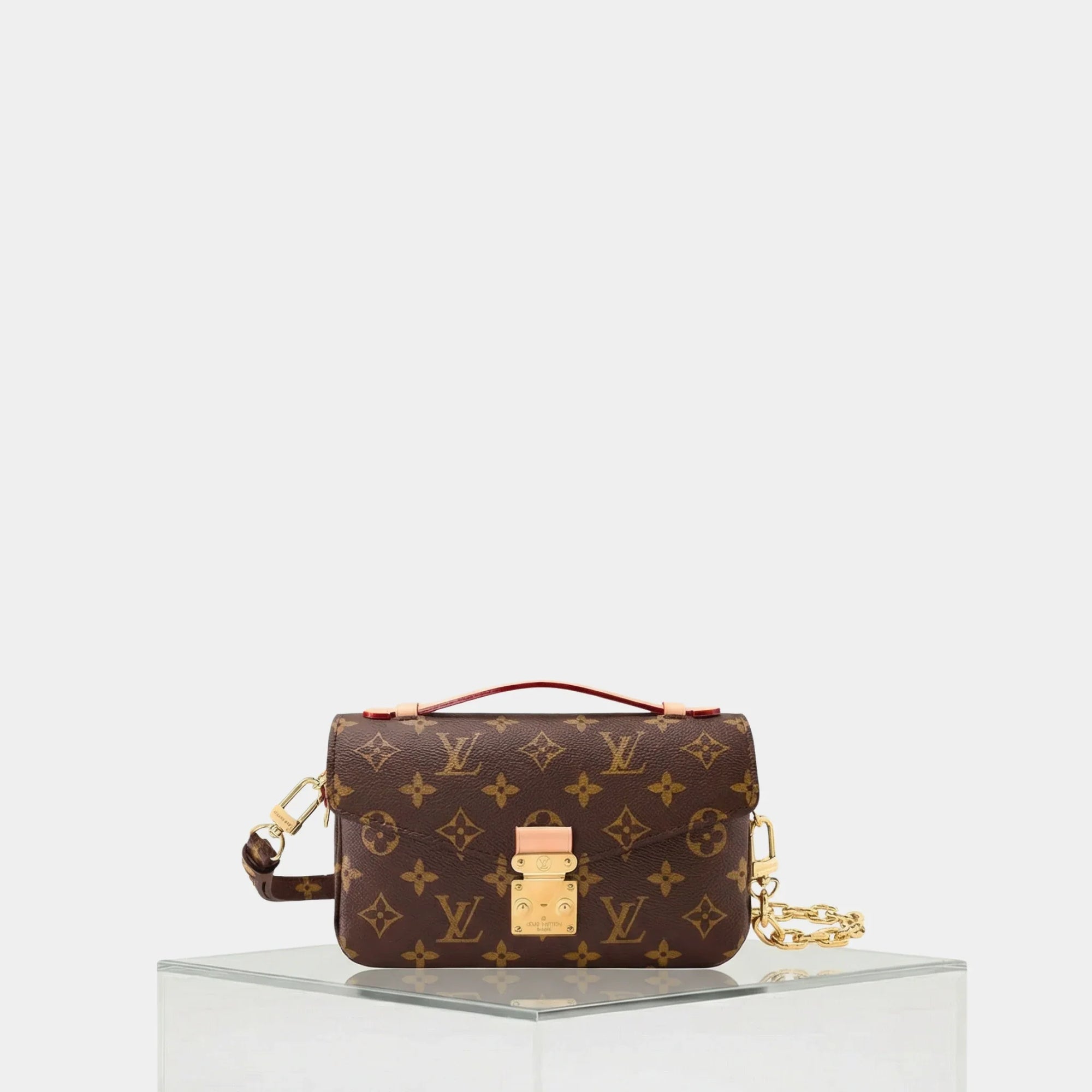 Pochette Métis East West Shoulder Bag Monogram Canvas Louis vuitton – Гарантія оригінальності – боковий вид