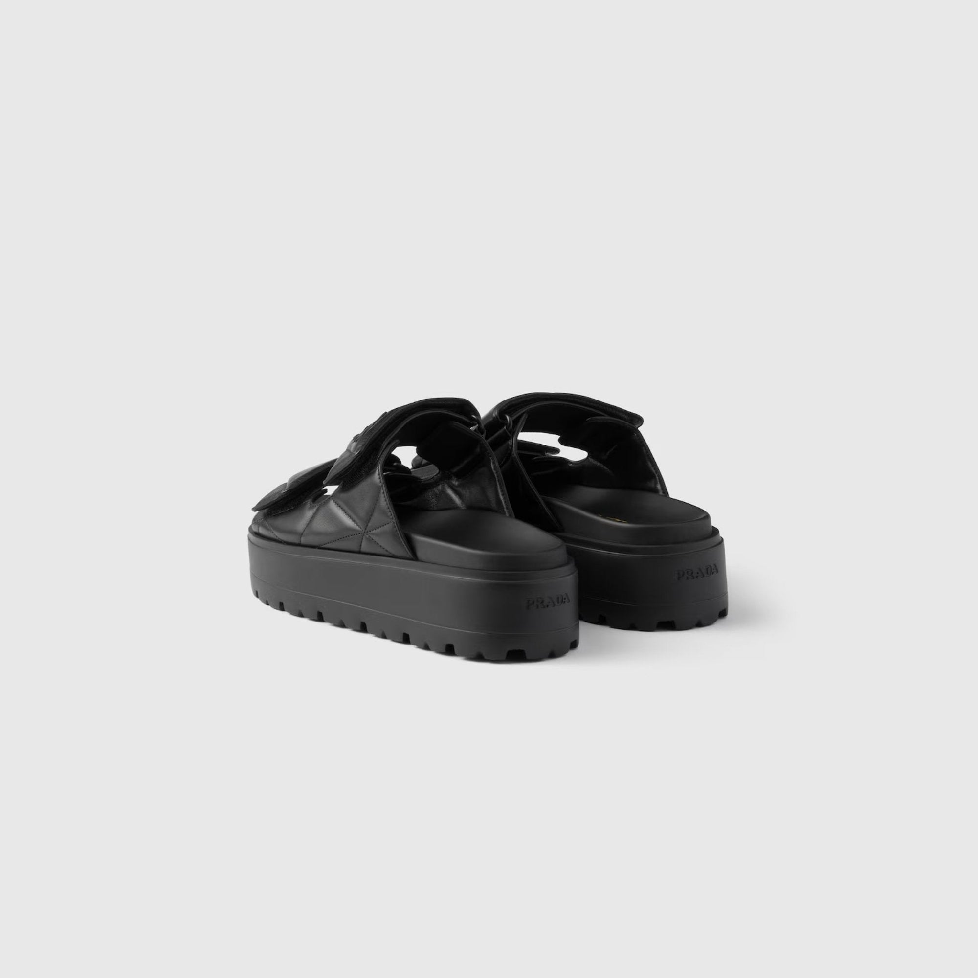 Оригінальна Padded Nappa Leather Slides With Rubber Platform Soles Prada – вид ззаду