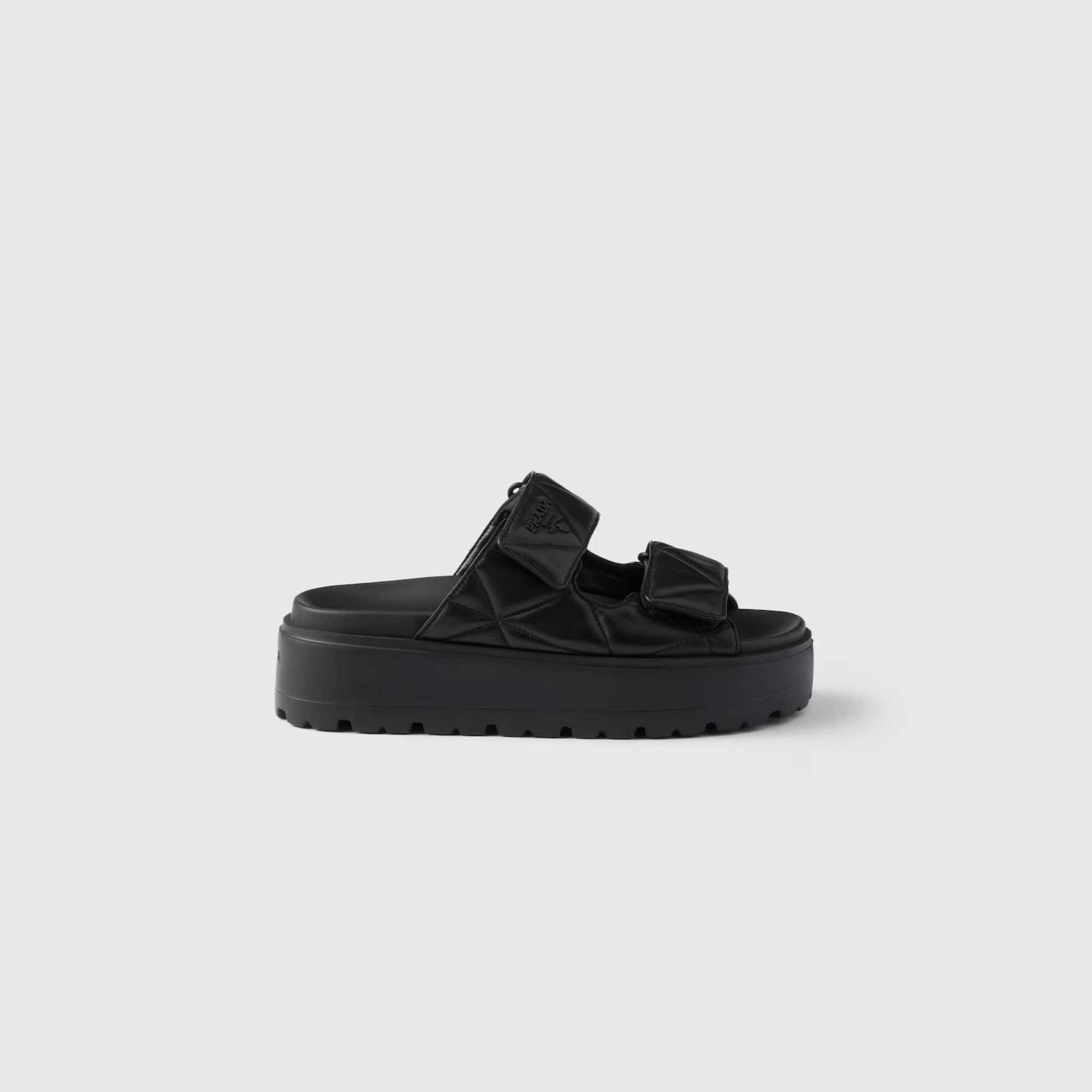 Оригінальна Padded Nappa Leather Slides With Rubber Platform Soles Prada – боковий вид